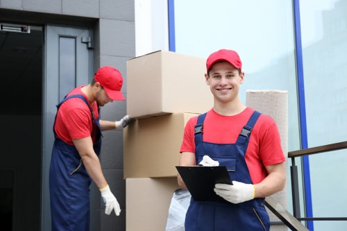 Removal company in Hounslow moving boxes into a home